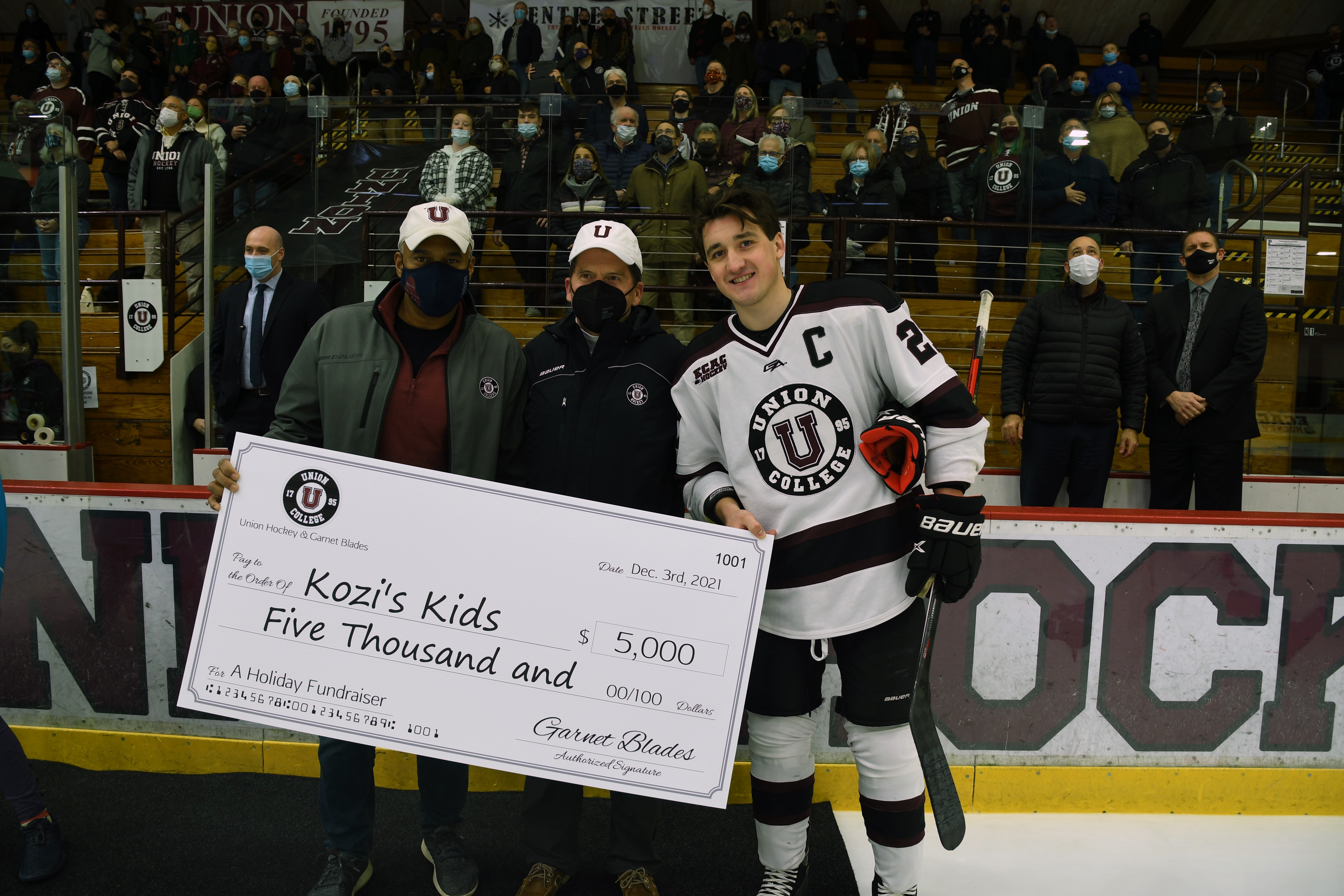 Former Oakville Blade Josh Kosack collected a small fortune to help out his local community. | Josh Kosack accepts a cheque for $5,000. One of many on his way to raising $50, 000 in support of the C.O.C.O.A. House afterschool program. | Union College